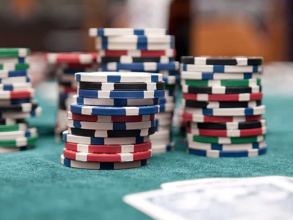 Casino chips at a card game table.