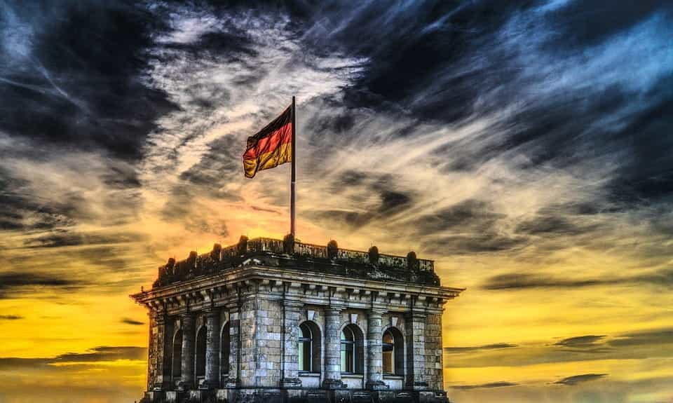 A German flag atop the Reichstag building in Berlin.