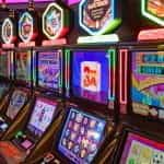 A row of glowing slot machines.