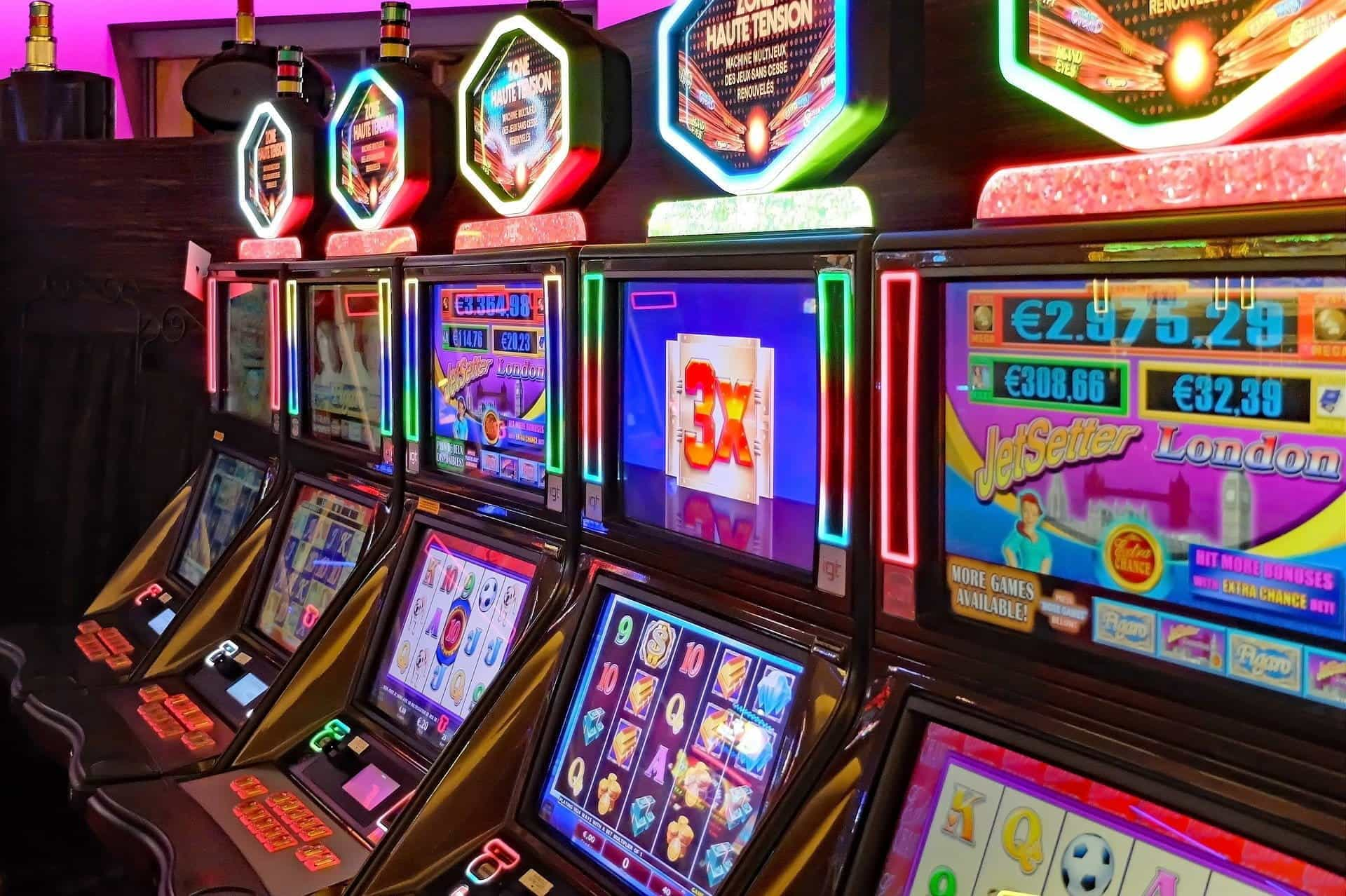 A row of glowing slot machines.