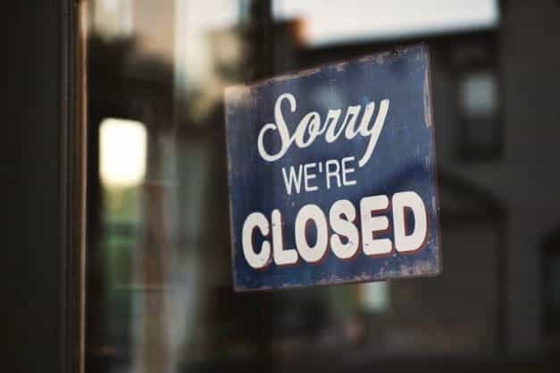 A closed sign in a shop door.