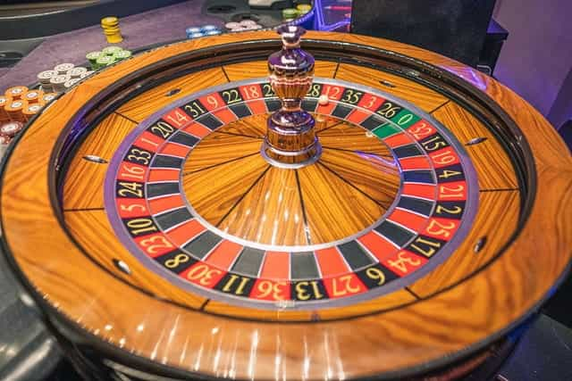 A roulette wheel spins.