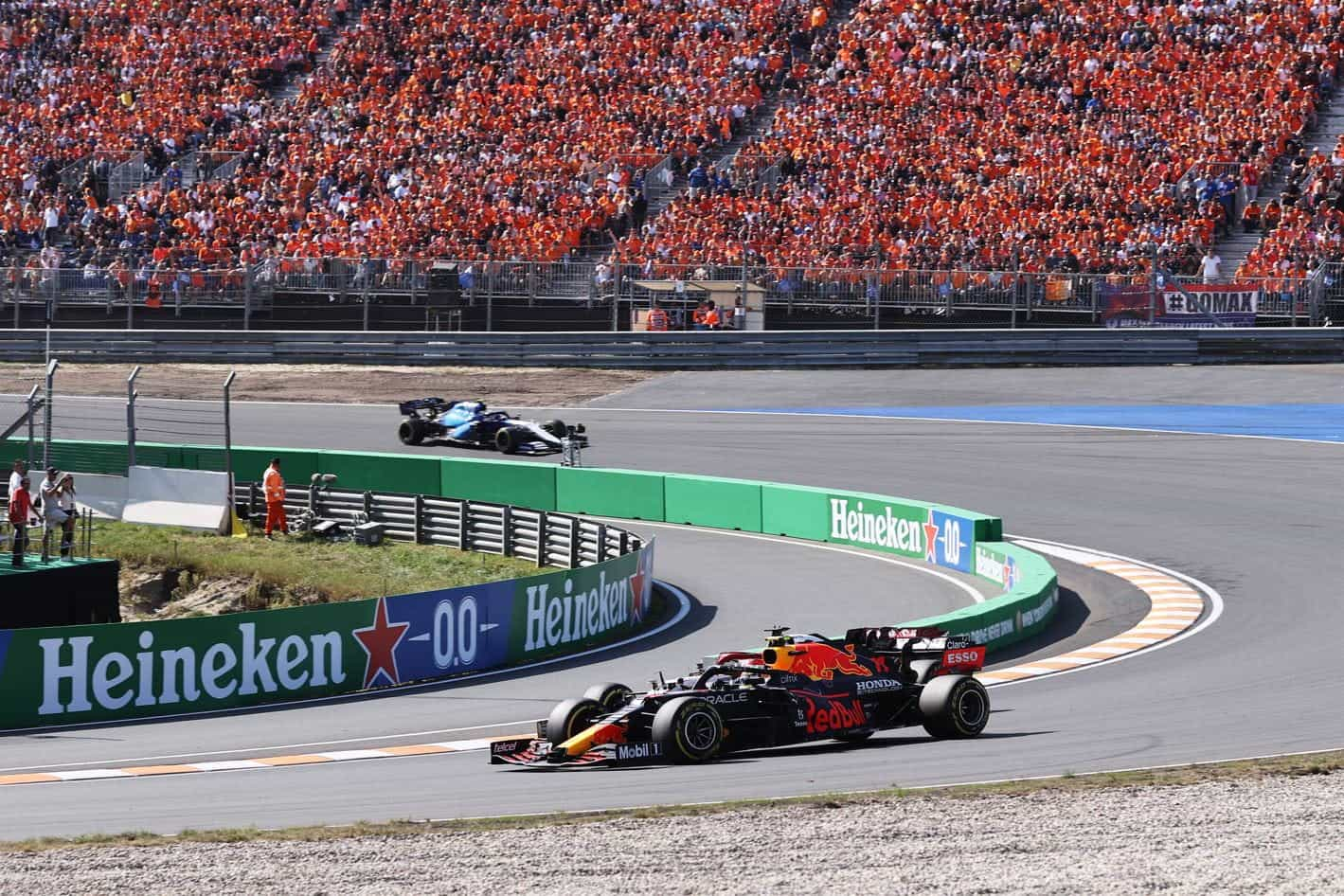 Sergio Perez racing before packed grandstands at the 2021 Dutch Grand Prix.