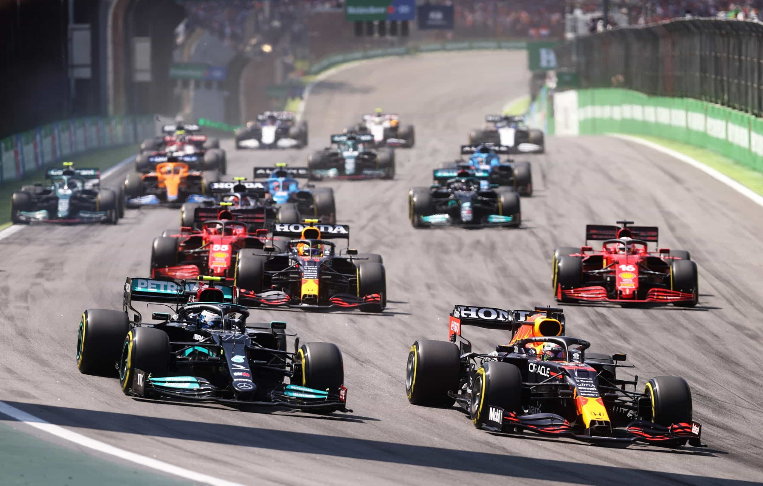 Cars race to the opening corner at the 2021 Brazilian Grand Prix.