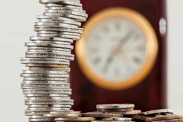 A tall stack of silver and bronze coins.