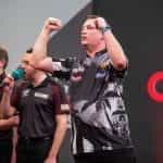 Chris Dobey at the oche during darts 2023 Masters..