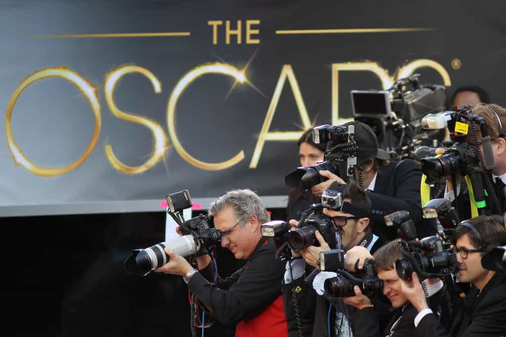 Photographers cover the red-carpet arrivals to the 85th Annual Academy Awards.