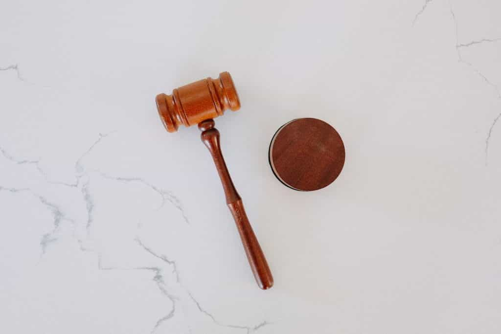 Mallet and gavel placed on a smooth surface