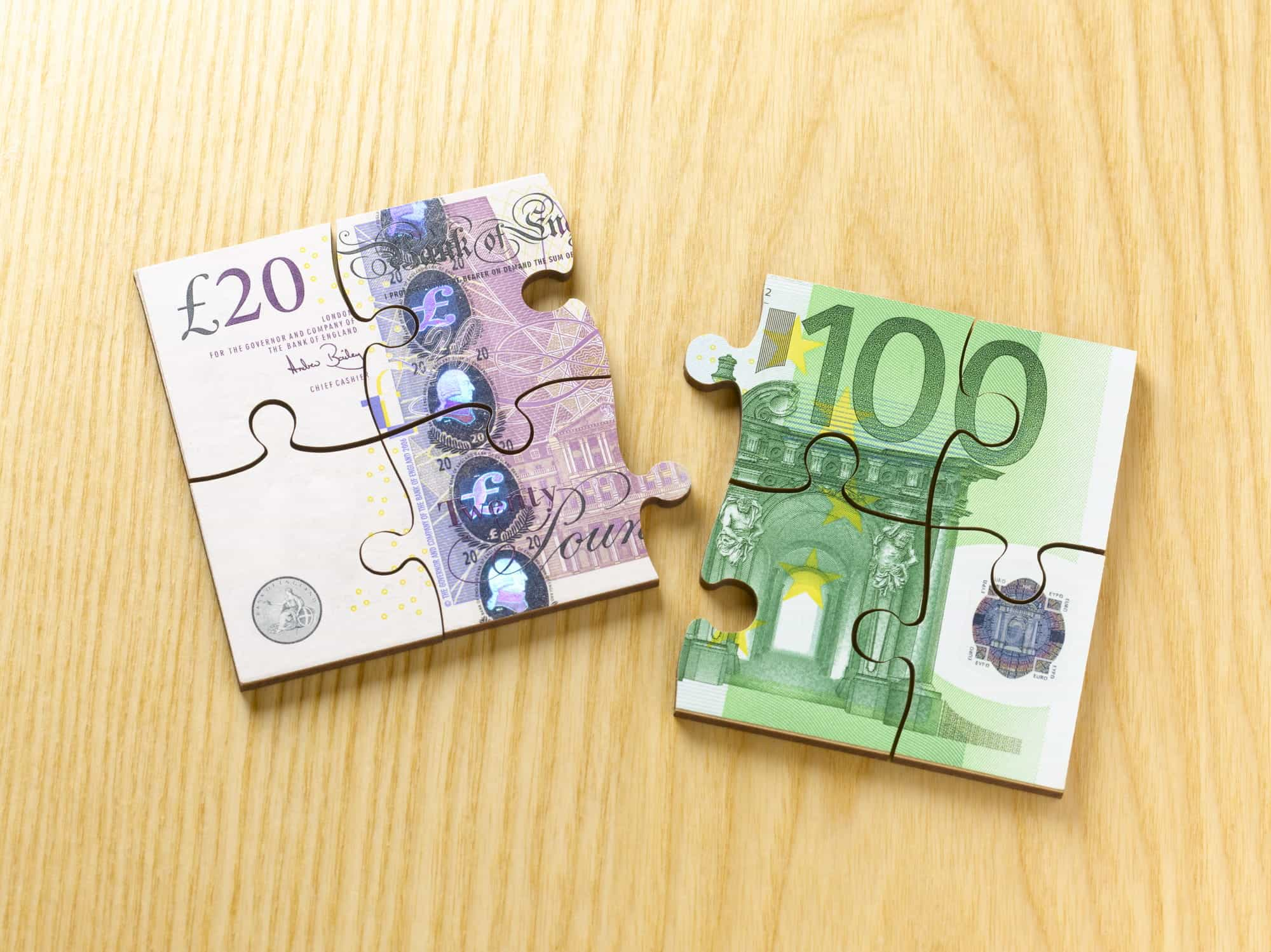 Euro and British Notes created to appear like jigsaw pieces.