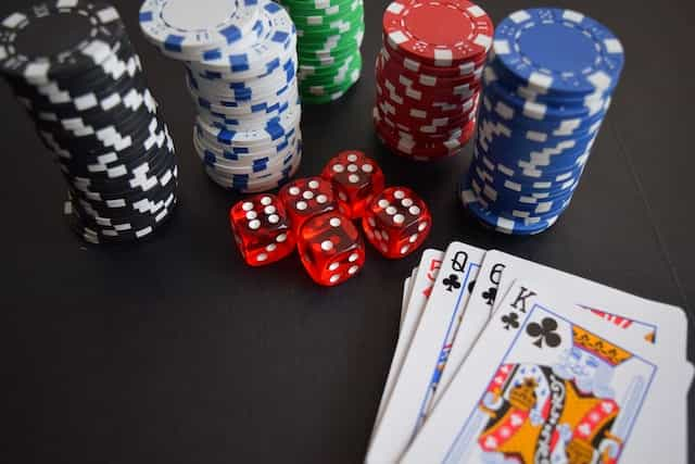 Poker chips, dice and playing cards.